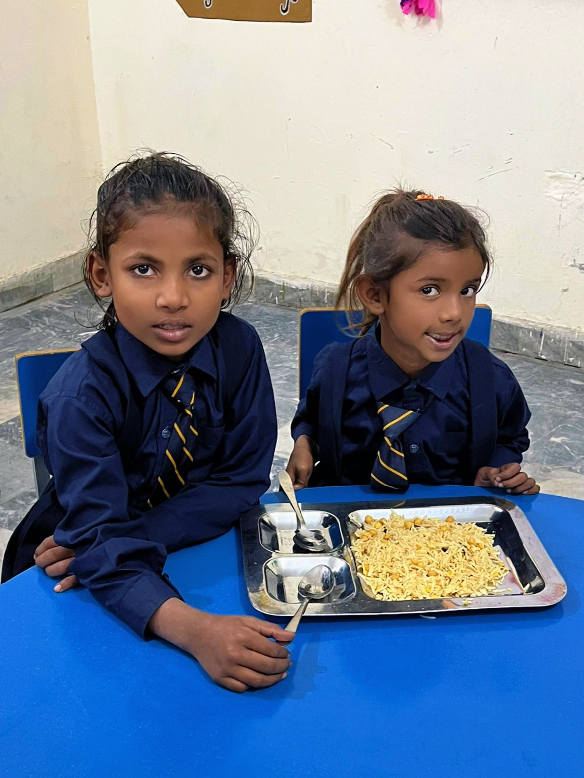 Children receiving nutritious meals through Nayi Uraan Foundation Nutrition Program